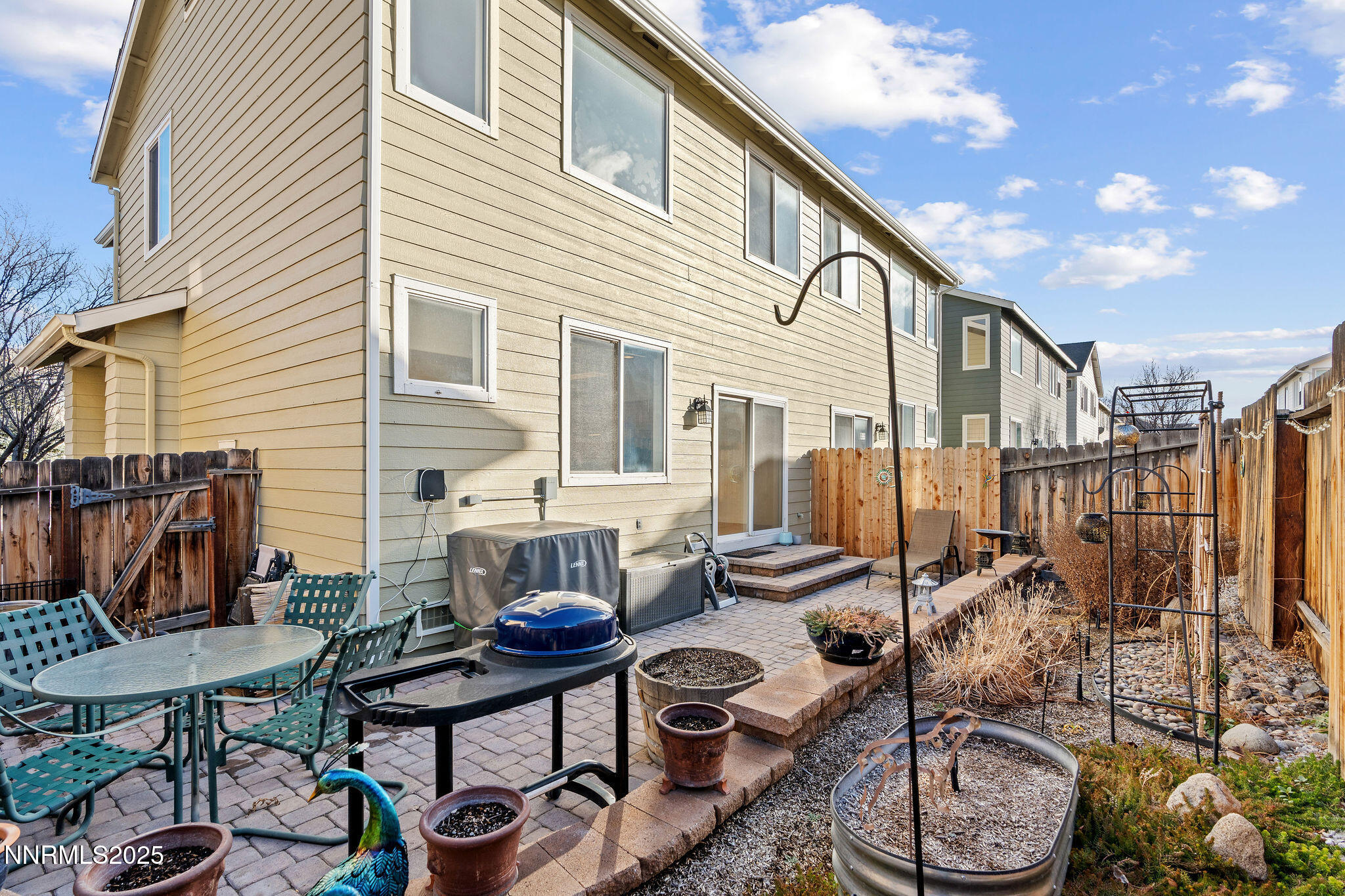 2125 Stanton Lane Reno, NV 89502 - Photo 36 of 48 a view of a patio with table and chairs and potted plants