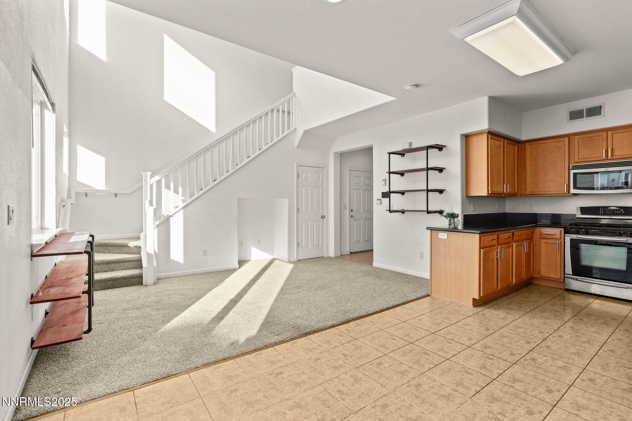 2125 Stanton Lane Reno, NV 89502 - Photo 10 of 48 a kitchen with granite countertop a stove and a refrigerator