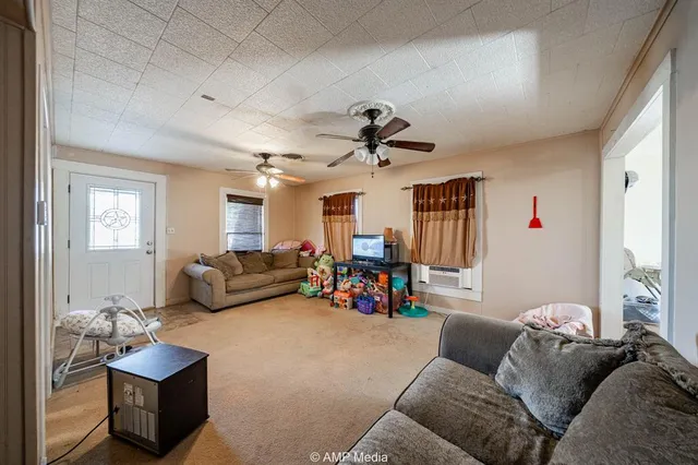 a bedroom with bed and a chandelier