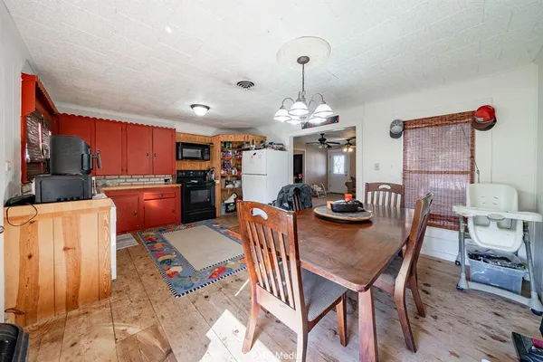 a kitchen with stainless steel appliances granite countertop a refrigerator and a stove