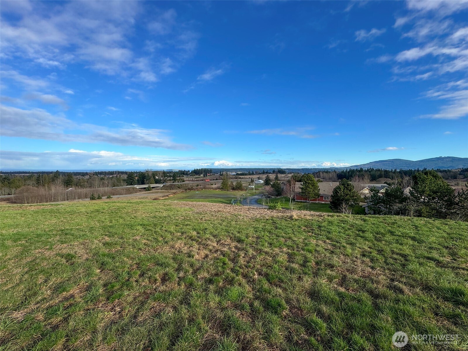 9999 Solana Parkway Sequim, WA 98382 - Photo 22 of 40 a view of a lake with a yard