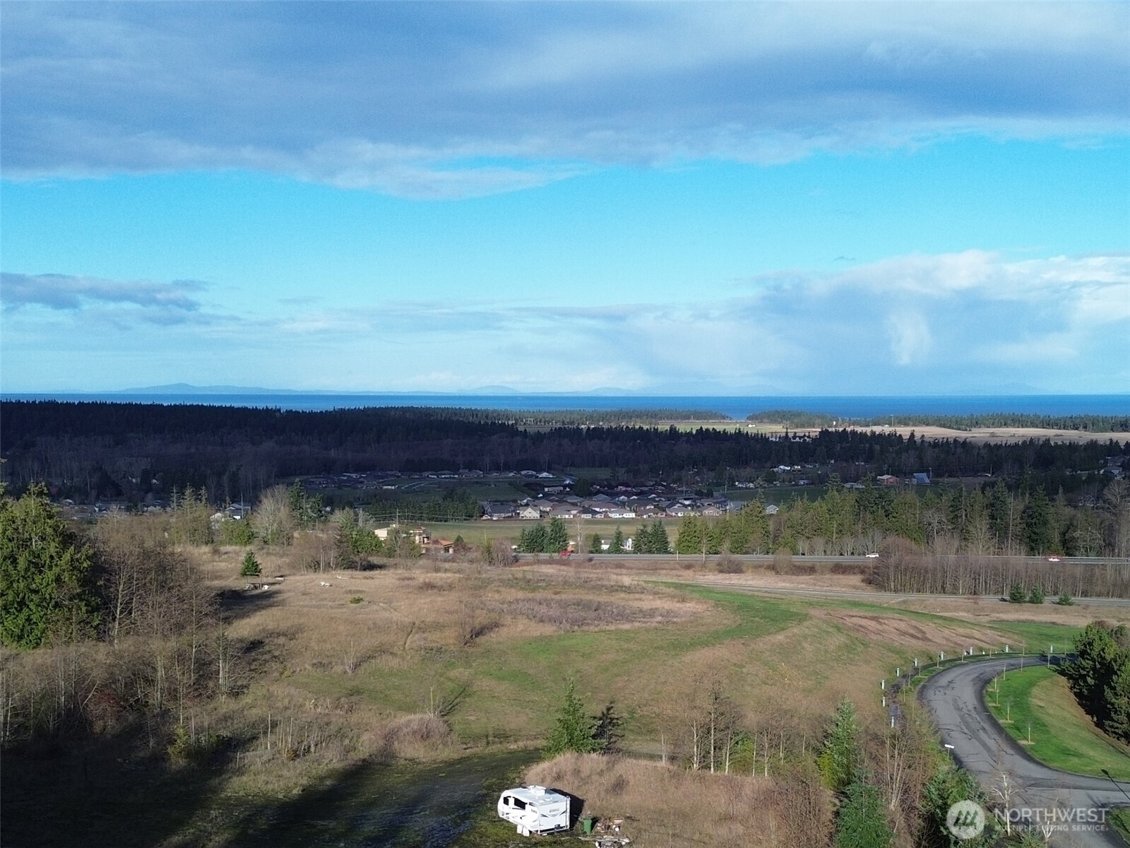 9999 Solana Parkway Sequim, WA 98382 - Photo 35 of 40 a view of a lake with a yard