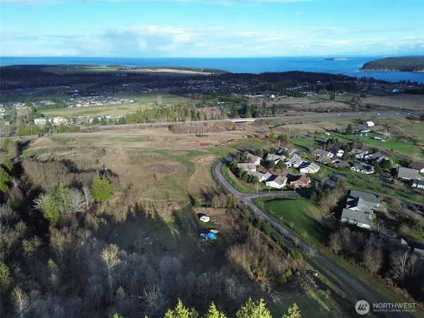 a view of a yard with an ocean