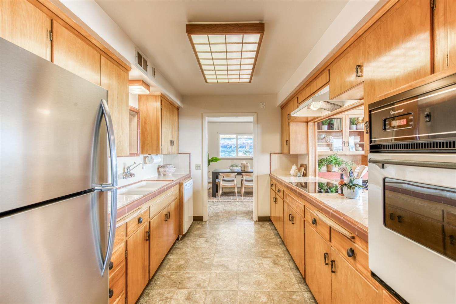 8 Ocean Front Lane Cayucos, CA 93430 - Photo 15 of 32 a kitchen with stainless steel appliances a refrigerator and a stove