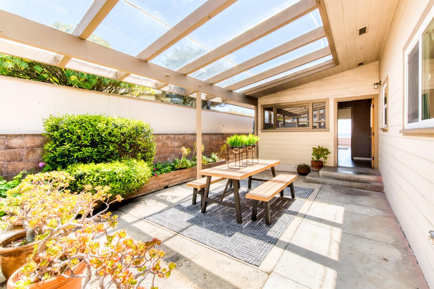 8 Ocean Front Lane Cayucos, CA 93430 - Photo 21 of 32 a view of a patio with table and chairs and potted plants