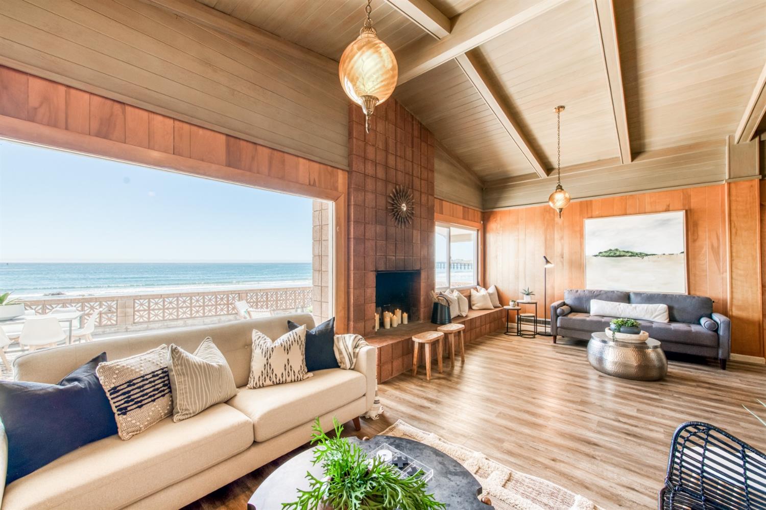 8 Ocean Front Lane Cayucos, CA 93430 - Photo 10 of 32 a living room with furniture chandelier and a large window