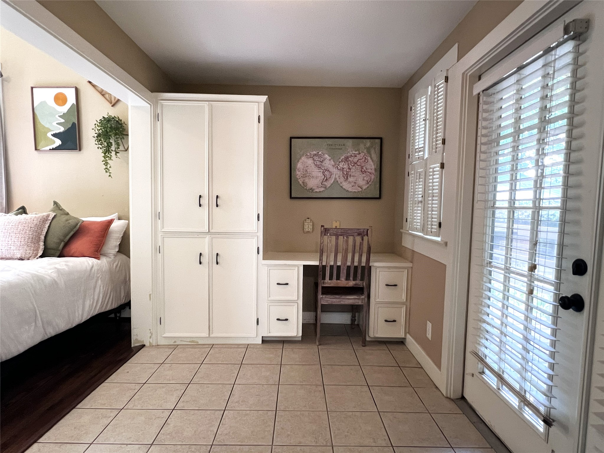 606 Sycamore Street Brenham, TX 77833 - Photo 15 of 27 a spacious bedroom with a bed and a cabinets