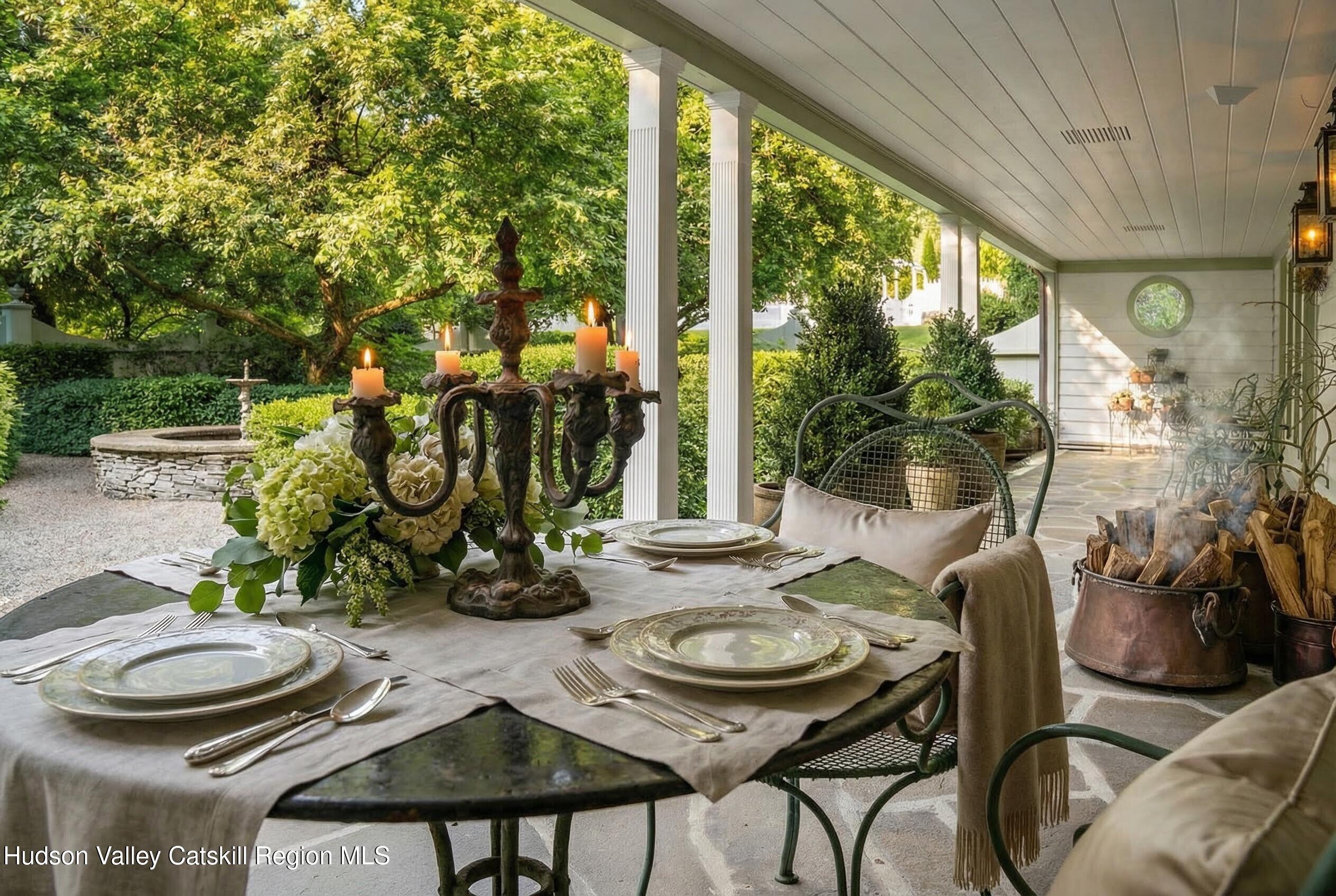 47 White Bridge Road Old Chatham, NY 12136 - Photo 27 of 68 a view of a patio with table and chairs potted plants and large tree