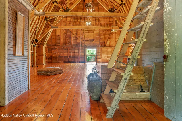 a view of a patio with table and chairs with wooden floor
