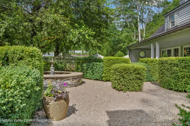a living room with fireplace furniture and a fireplace