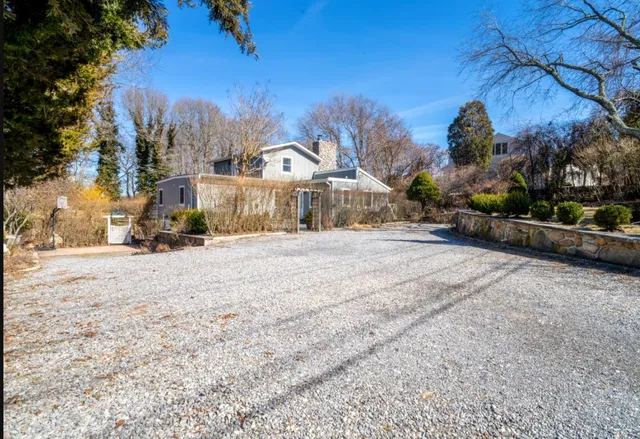 a view of a town with snow on the road