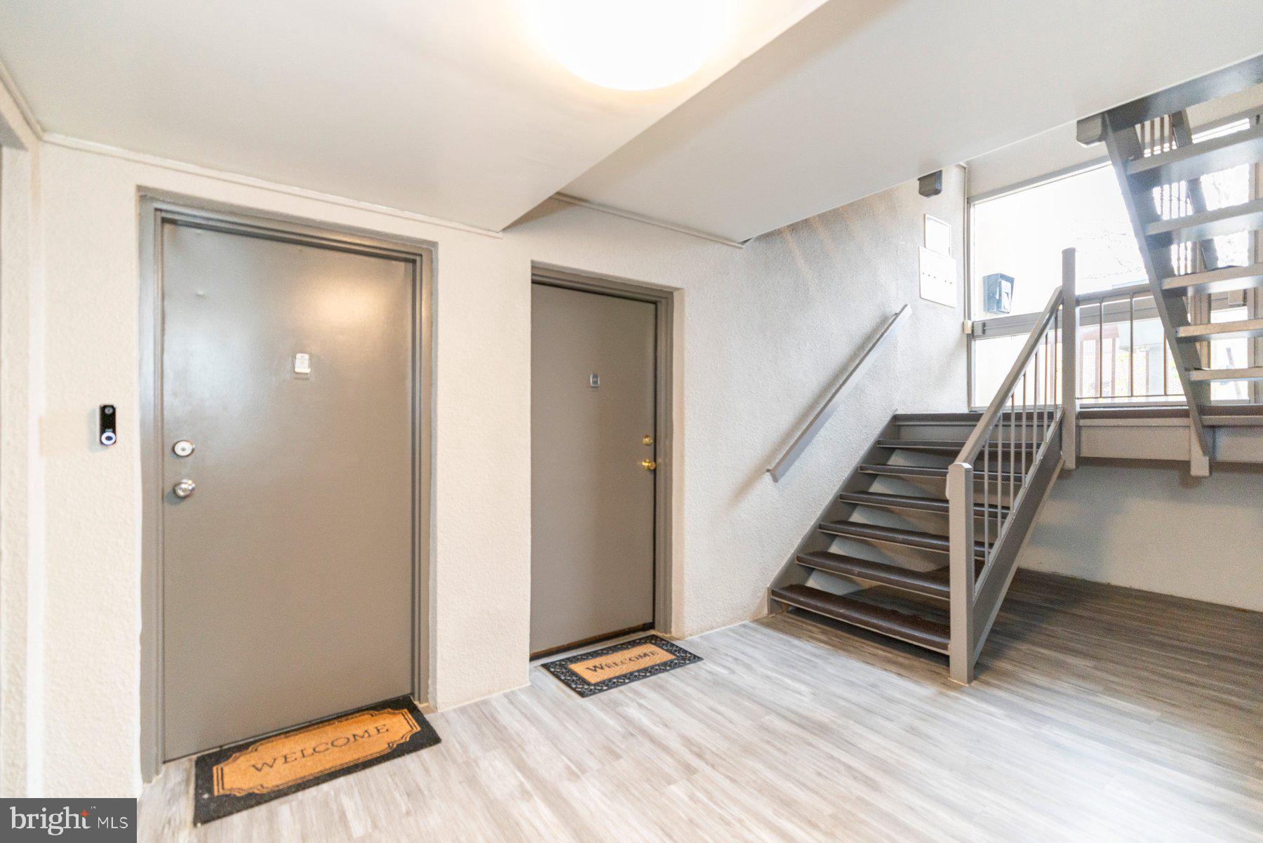 5866 Thunder Hill Road, Unit A4 Columbia, MD 21045 - Photo 16 of 20 a view of room with stairs and wooden floor