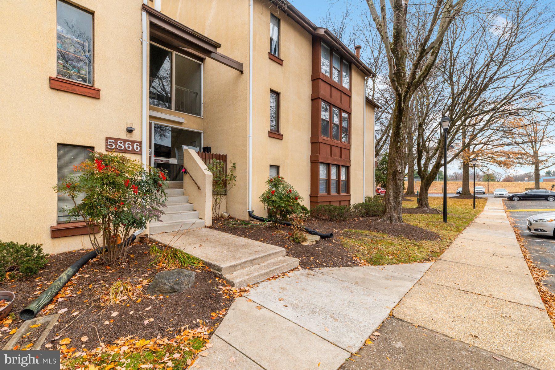 5866 Thunder Hill Road, Unit A4 Columbia, MD 21045 - Photo 18 of 20 a view of a building with many windows
