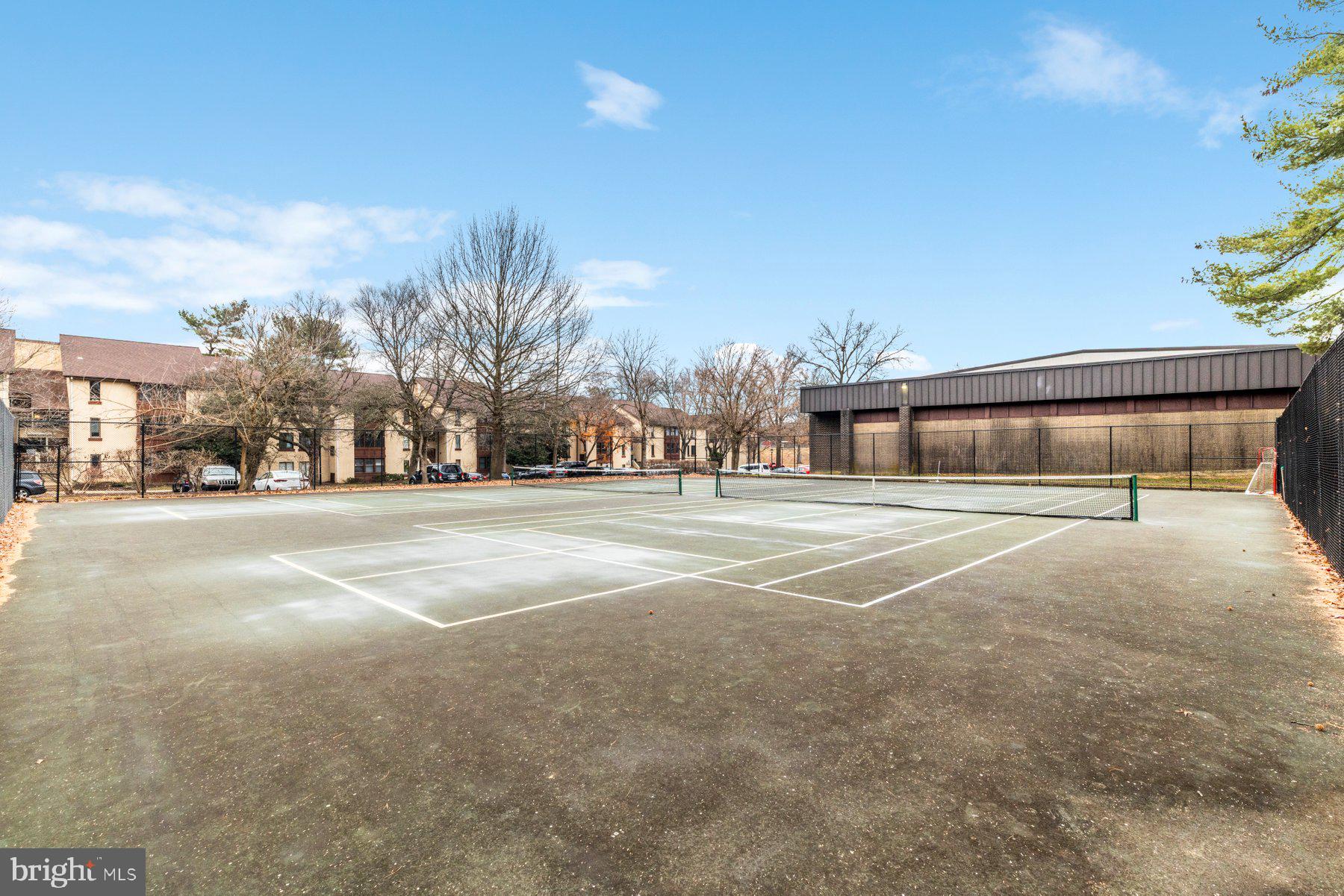 5866 Thunder Hill Road, Unit A4 Columbia, MD 21045 - Photo 20 of 20 a building with trees in front of it