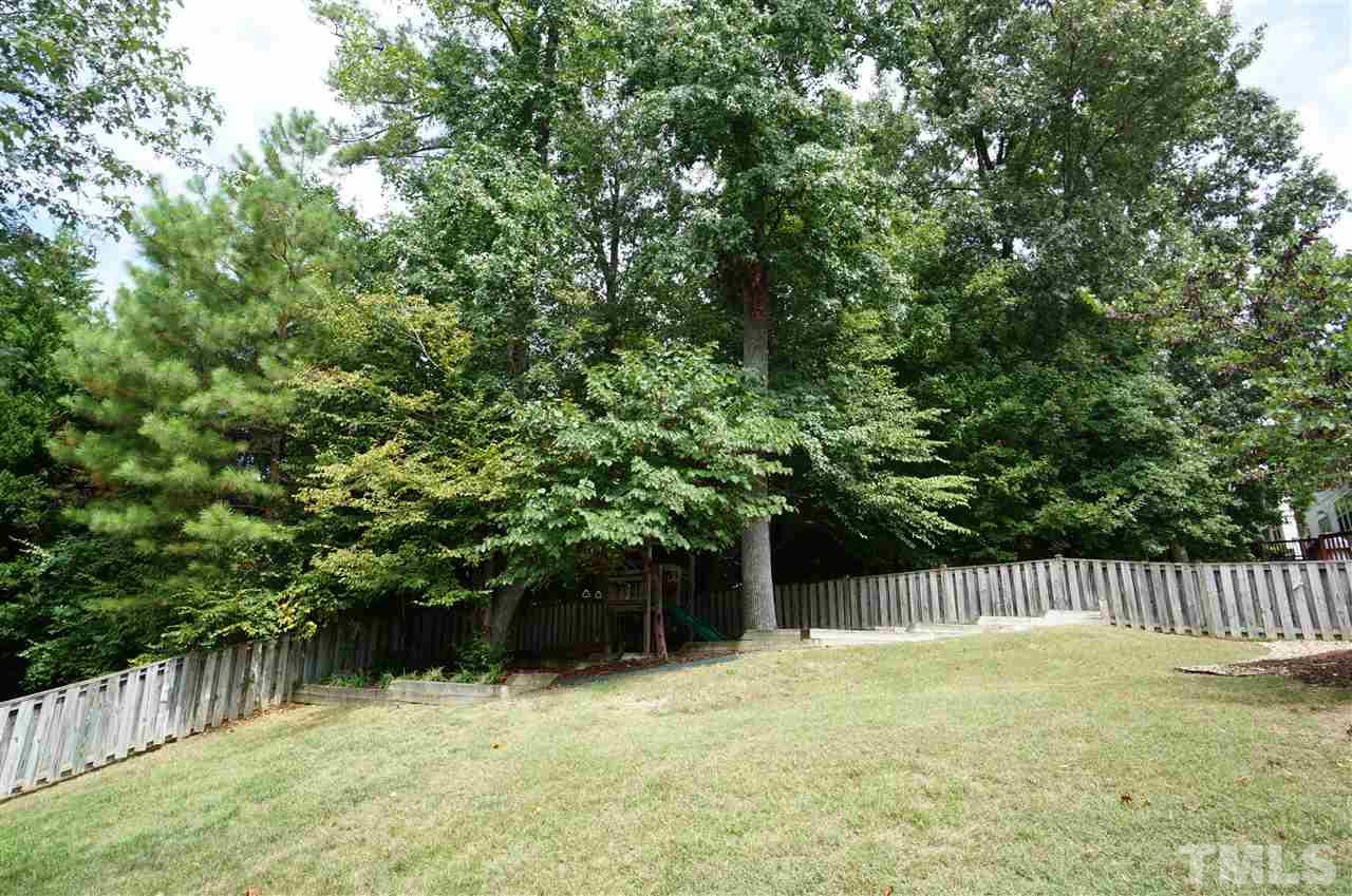 2401 Springfield Park Drive Raleigh, NC 27614 - Photo 22 of 25 a house with trees in front of it
