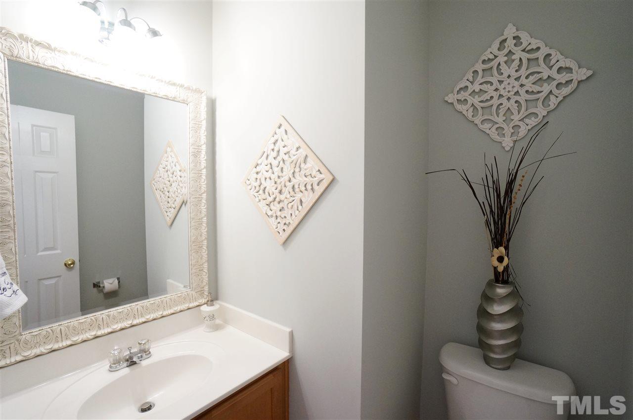 2401 Springfield Park Drive Raleigh, NC 27614 - Photo 8 of 25 a bathroom with a sink and a mirror
