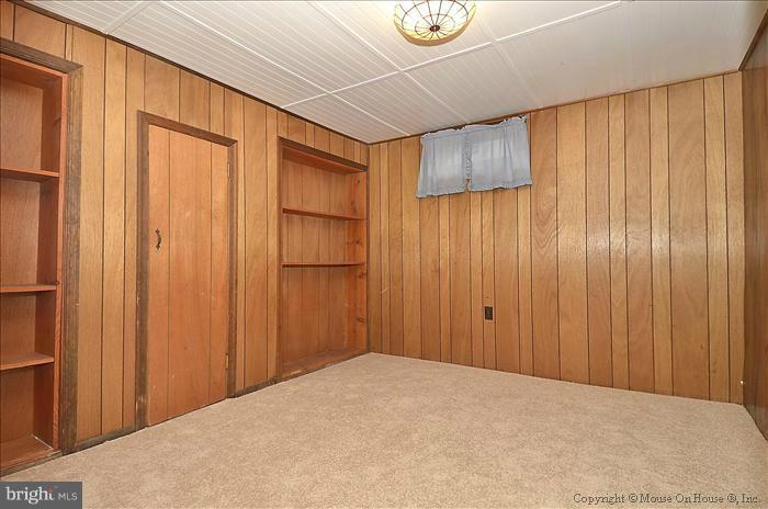 4219 Round Hill Road Silver Spring, MD 20906 - Photo 1 of 19 a view of a room with wooden walls
