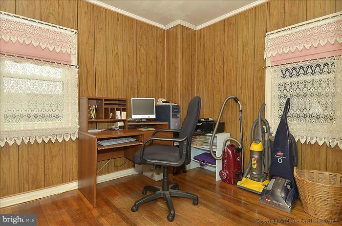 4219 Round Hill Road Silver Spring, MD 20906 - Photo 11 of 19 a view of a workspace with furniture and a window