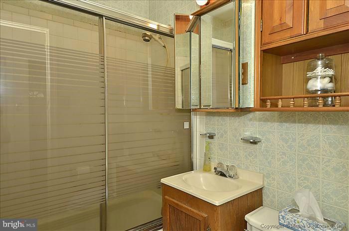 4219 Round Hill Road Silver Spring, MD 20906 - Photo 15 of 19 a bathroom with a sink a toilet and shower