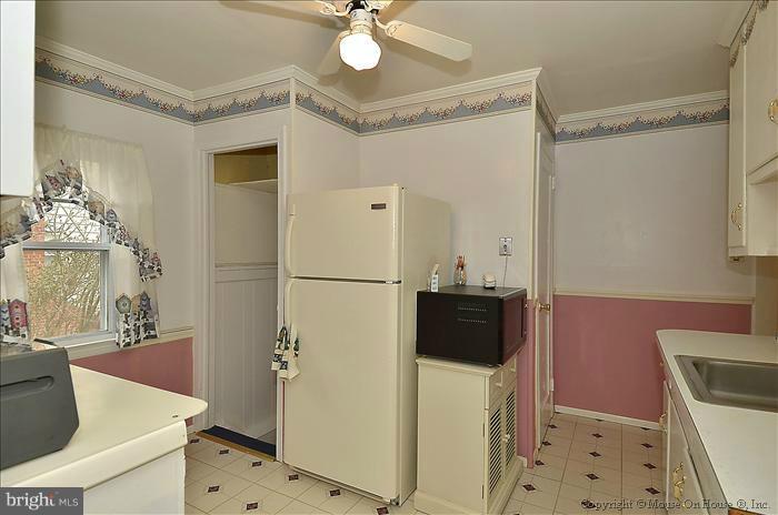 4219 Round Hill Road Silver Spring, MD 20906 - Photo 6 of 19 a bathroom with a sink a toilet a mirror and shower