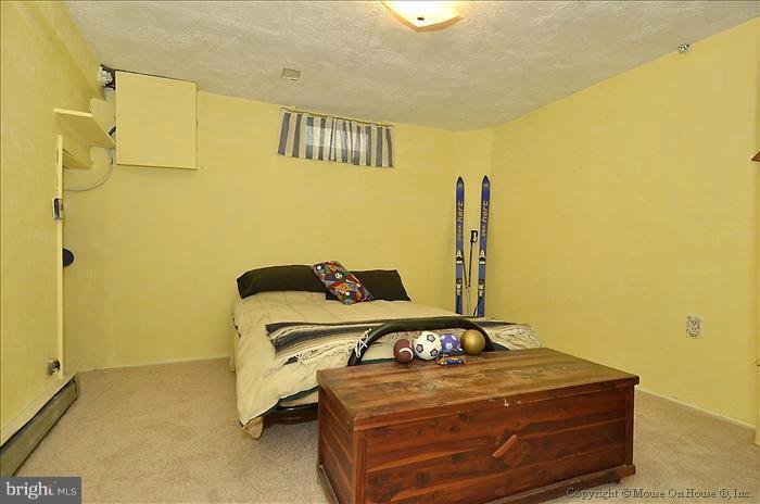 4219 Round Hill Road Silver Spring, MD 20906 - Photo 8 of 19 a room with a air conditioner duct and white walls