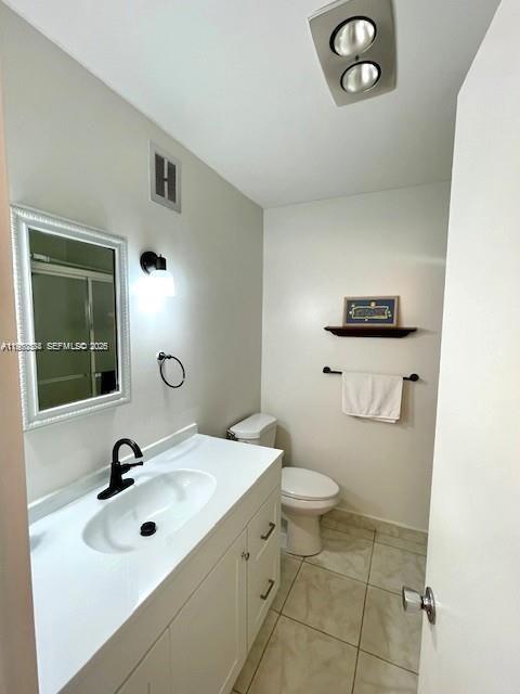 5300 Washington Street, Unit S112 Hollywood, FL 33021 - Photo 9 of 10 a bathroom with a sink a toilet and a mirror