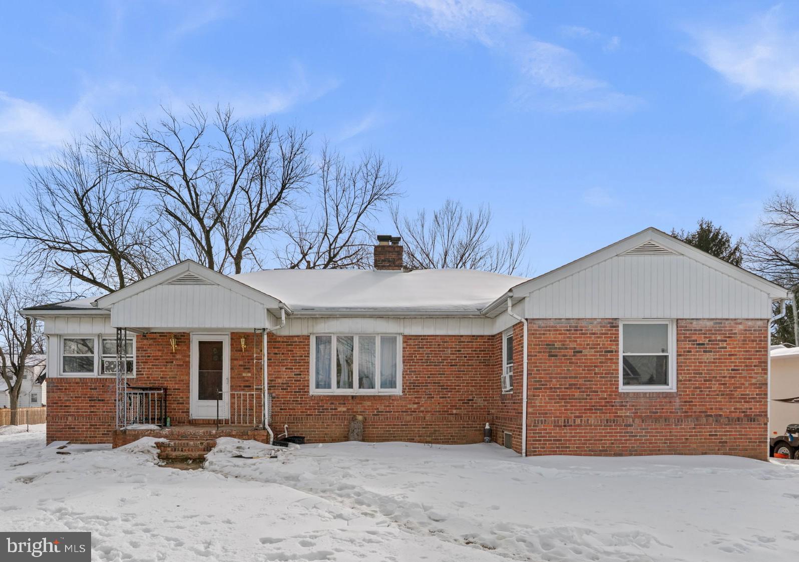 201 9th Avenue Baltimore, MD 21225 - Photo 1 of 11 a front view of a house with a yard