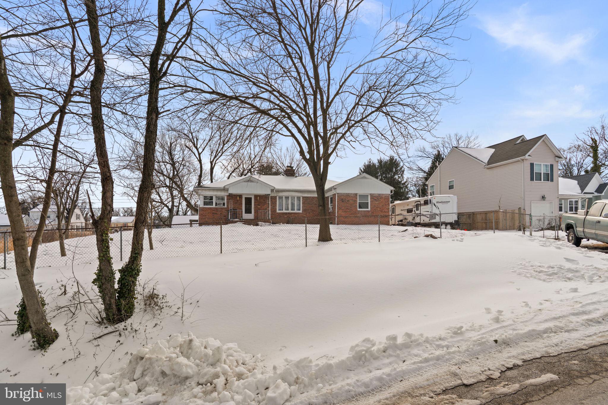 201 9th Avenue Baltimore, MD 21225 - Photo 10 of 11 a street view covered with snow