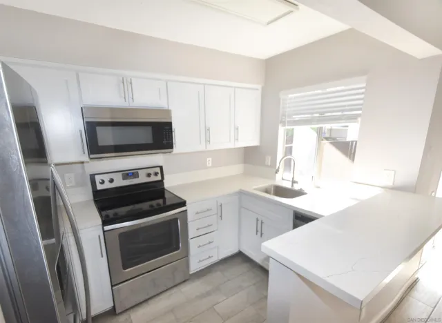 a kitchen with a stove and a microwave