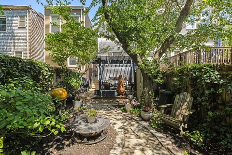 a backyard of a house with outdoor seating