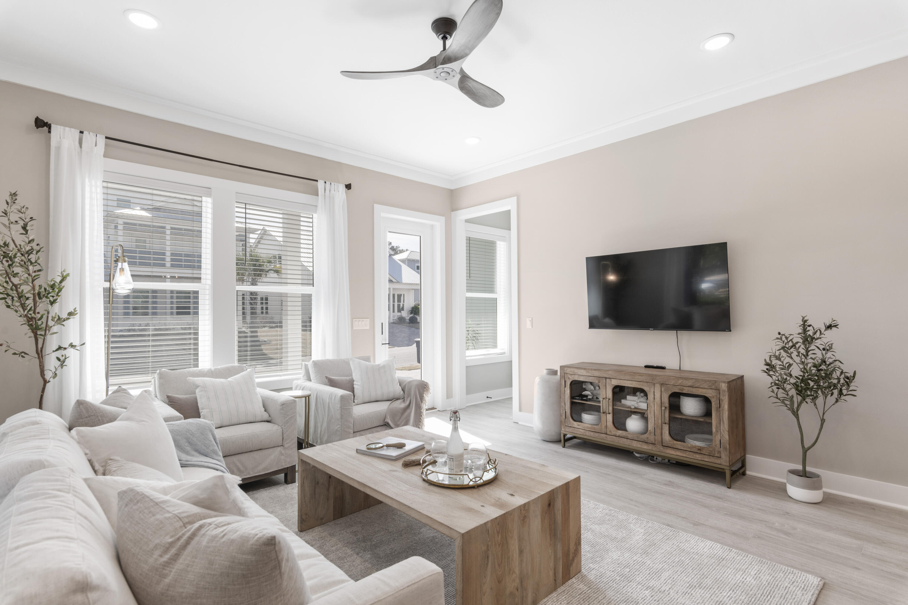 95 West Willow Mist Road Inlet Beach, FL 32461 - Photo 12 of 49 a living room with furniture a flat screen tv and a large window