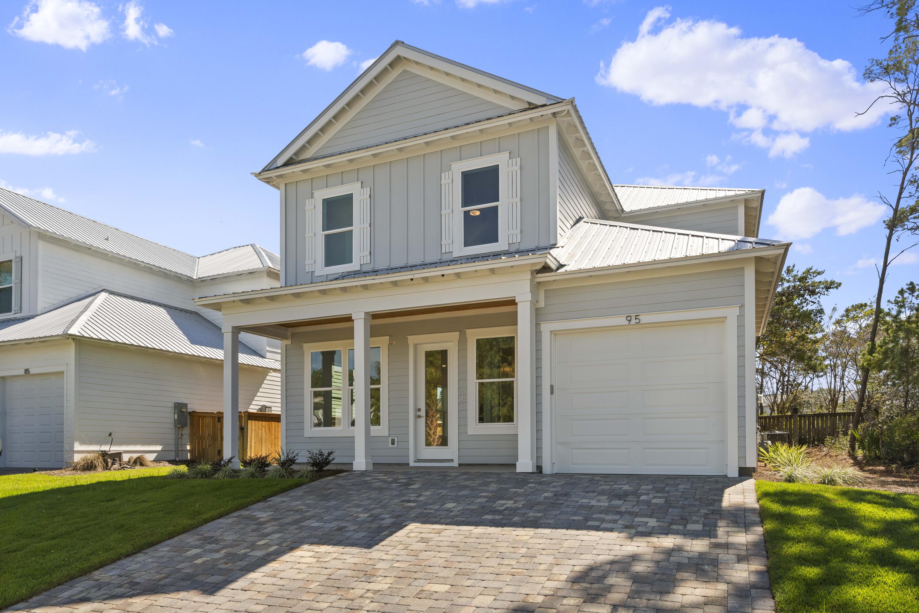 95 West Willow Mist Road Inlet Beach, FL 32461 - Photo 2 of 49 a front view of a house with a yard