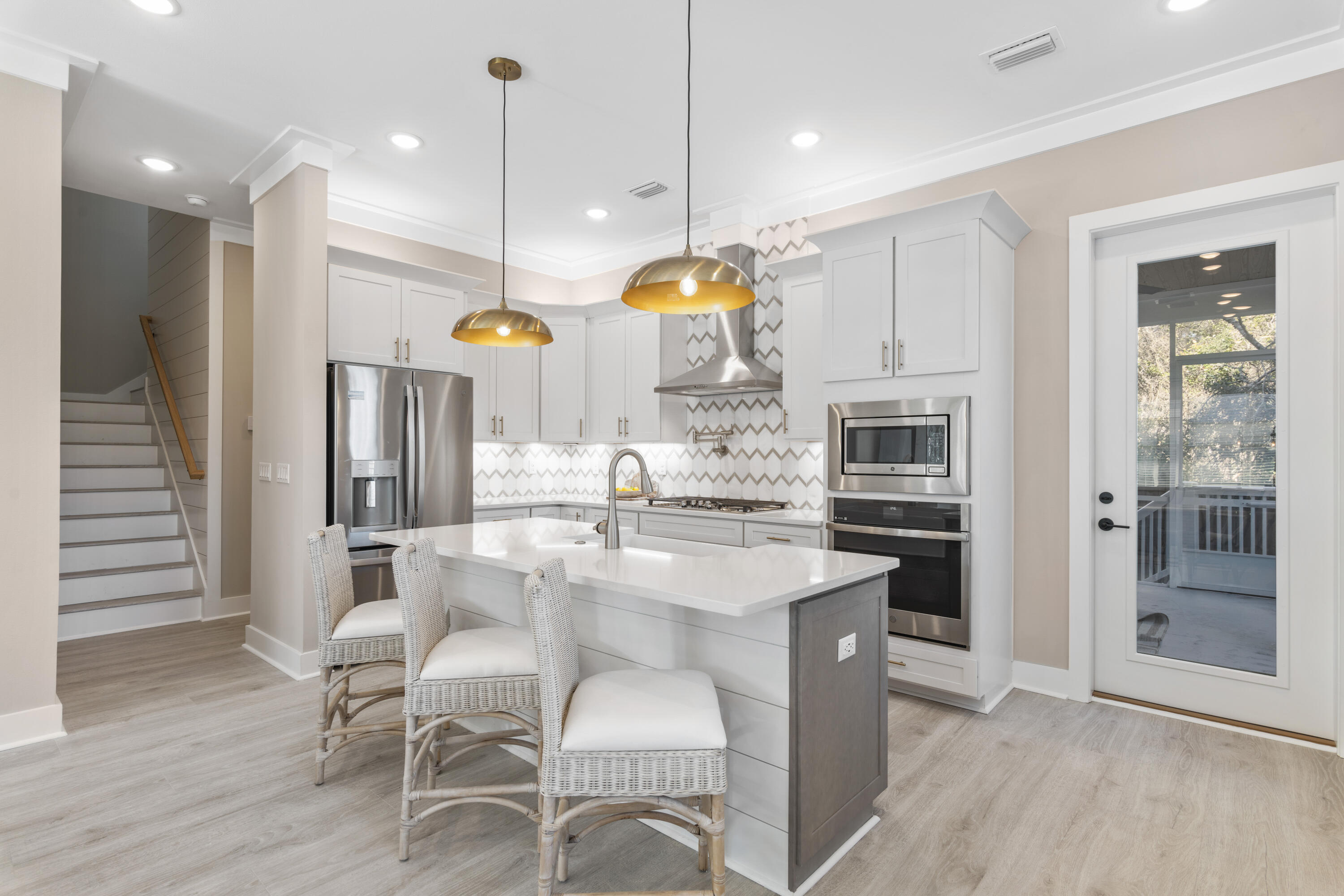 95 West Willow Mist Road Inlet Beach, FL 32461 - Photo 6 of 49 a kitchen with cabinets and chairs
