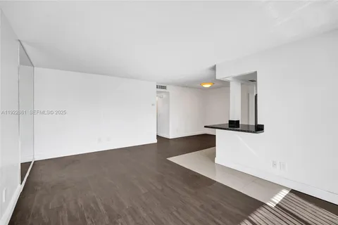 a kitchen with cabinets and stainless steel appliances