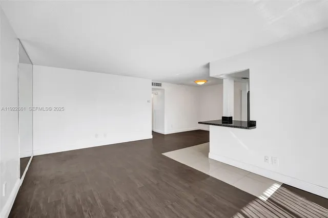 a kitchen with cabinets and stainless steel appliances