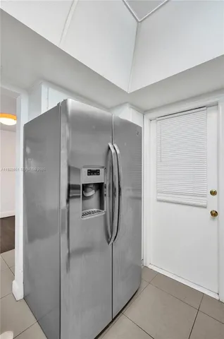 a bathroom with a granite countertop sink mirror vanity and toilet