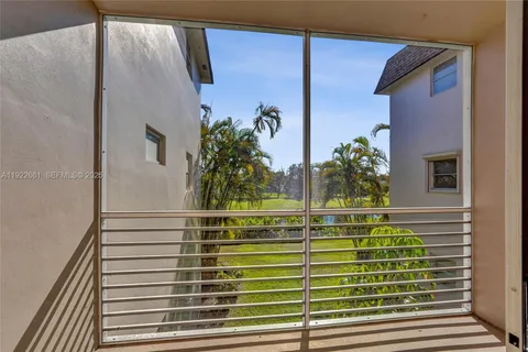 a view of balcony with wooden floor