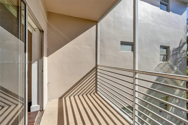 a view of an empty room with a fireplace