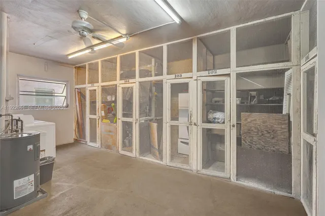 a view of swimming pool with outdoor seating and plants