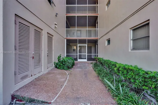 an entryway of a room with wooden floor