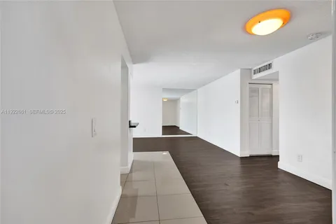 a kitchen with stainless steel appliances kitchen island sink refrigerator and stove