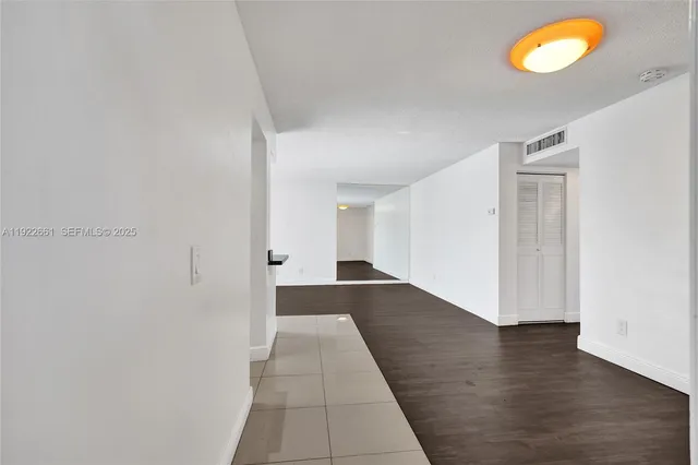 a kitchen with stainless steel appliances kitchen island sink refrigerator and stove