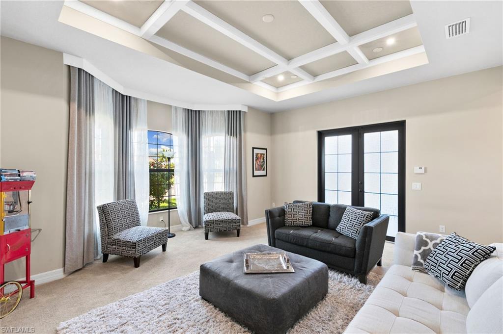 4370 Caldera Circle Naples, FL 34119 - Photo 12 of 35 a living room with furniture and a large window