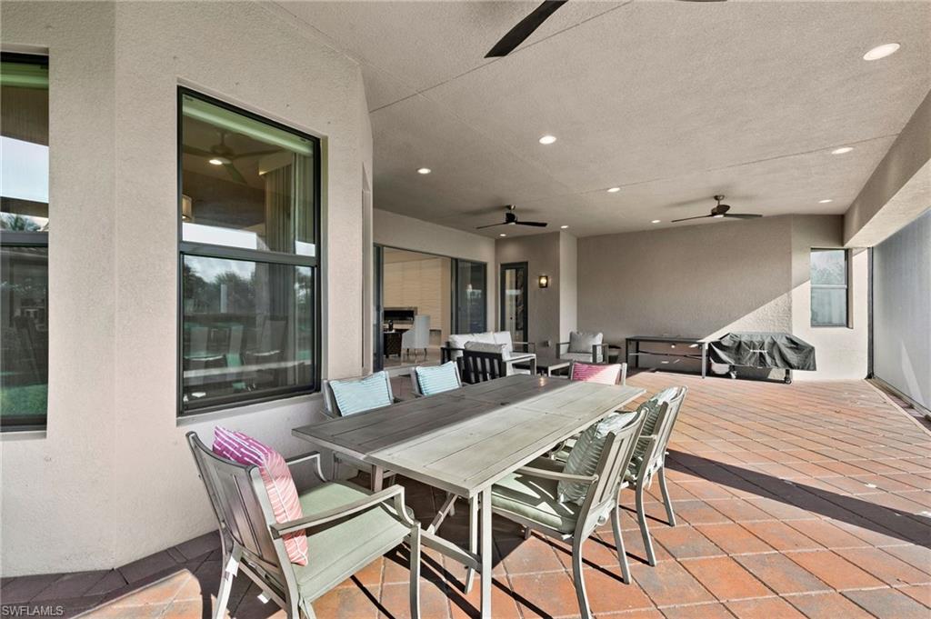 4370 Caldera Circle Naples, FL 34119 - Photo 28 of 35 a dining room with furniture and window
