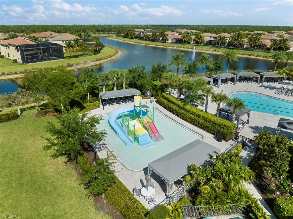 4370 Caldera Circle Naples, FL 34119 - Photo 29 of 35 an aerial view of a house with a lake view