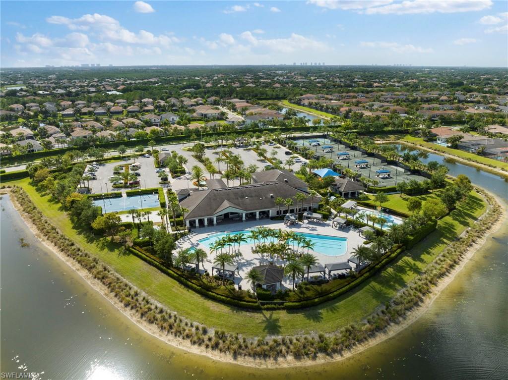 4370 Caldera Circle Naples, FL 34119 - Photo 31 of 35 an aerial view of residential houses with outdoor space and swimming pool