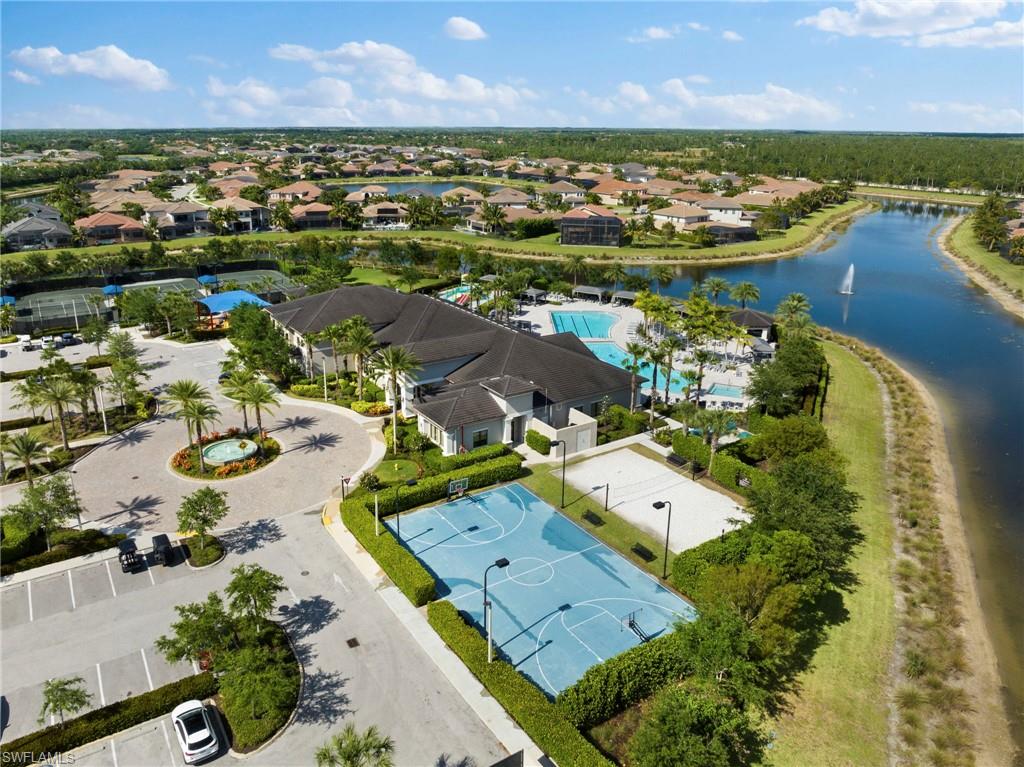 4370 Caldera Circle Naples, FL 34119 - Photo 33 of 35 an aerial view of a house with a lake view