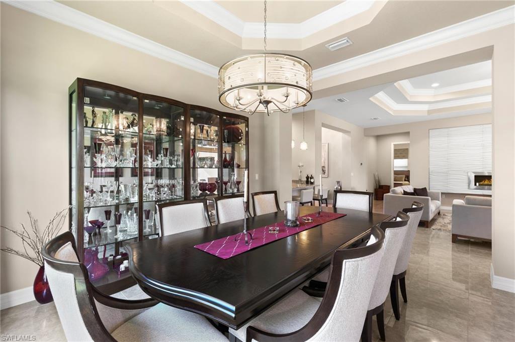 4370 Caldera Circle Naples, FL 34119 - Photo 9 of 35 a view of a dining room with furniture window and outside view