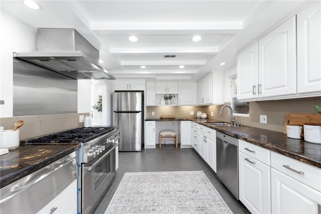 3219 Gibson Place Redondo Beach, CA 90278 - Photo 21 of 47 a large kitchen with stainless steel appliances granite countertop a stove and a refrigerator