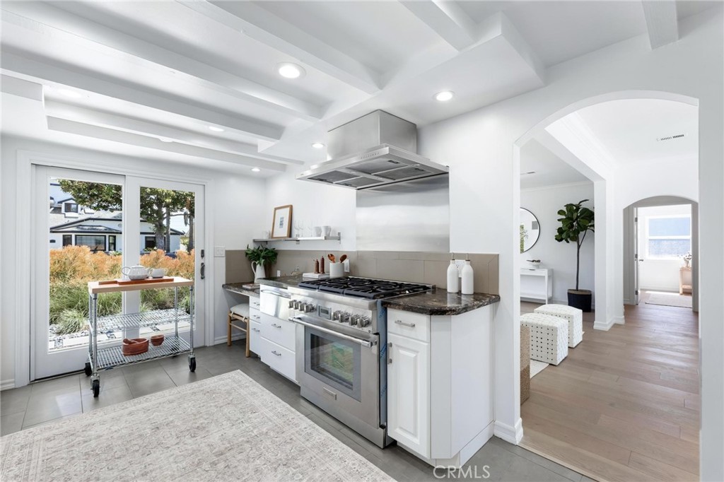 3219 Gibson Place Redondo Beach, CA 90278 - Photo 27 of 47 a kitchen with stainless steel appliances granite countertop a stove and a view of living room